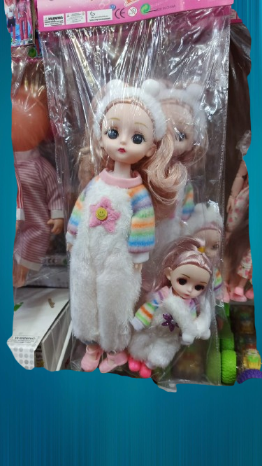 Cute fluffy doll with her baby, rainbow sleeves